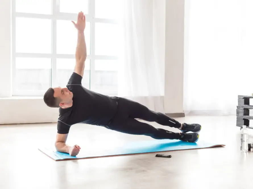 Beginner doing shoulder exercises at home without weights