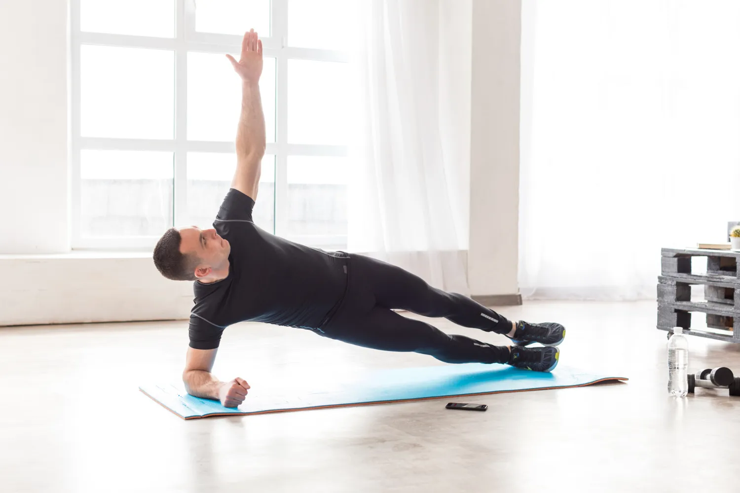 Beginner doing shoulder exercises at home without weights