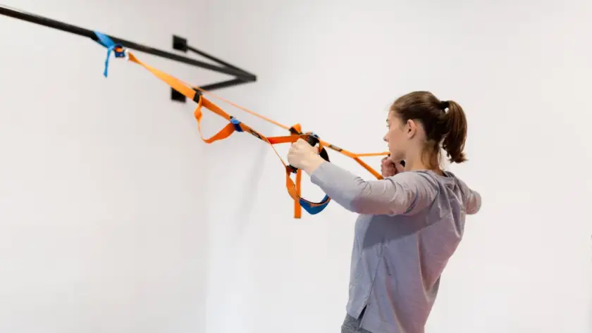 Doorway rows exercise at home for back muscles without gym equipment