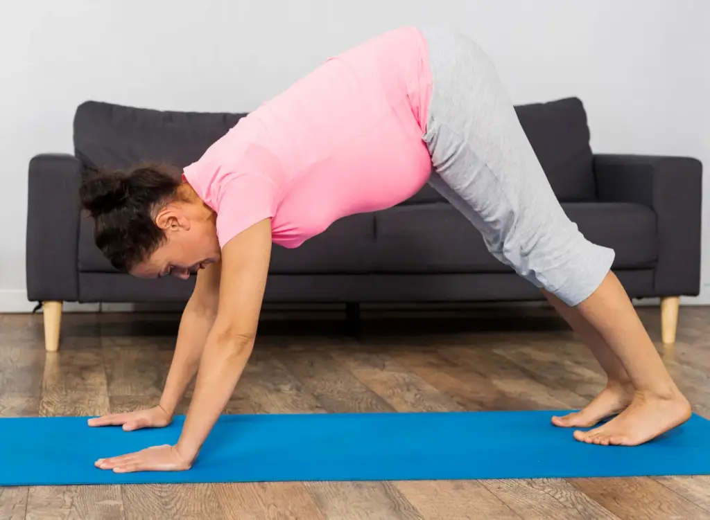 Person doing plank to downward dog for shoulder strength and flexibility