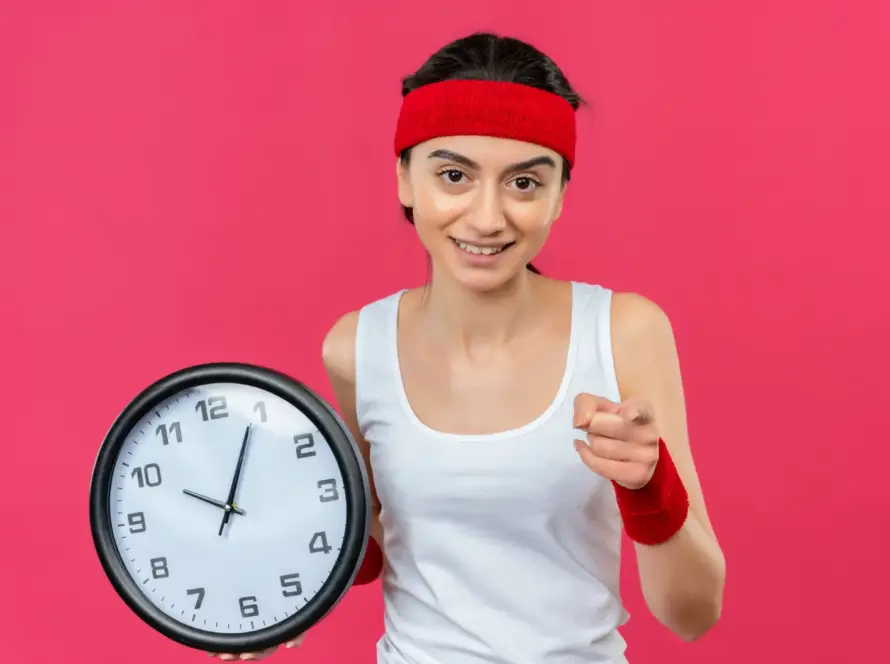 Woman checking weight on scale as part of a fast weight loss plan