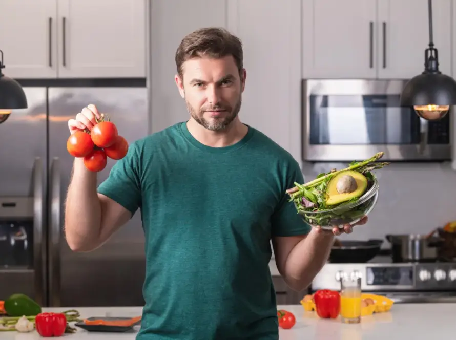 Assorted iron-rich foods including spinach, lentils, red meat, and nuts on a wooden table”