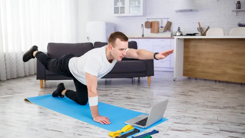 Man stretching after completing a HIIT workout at home