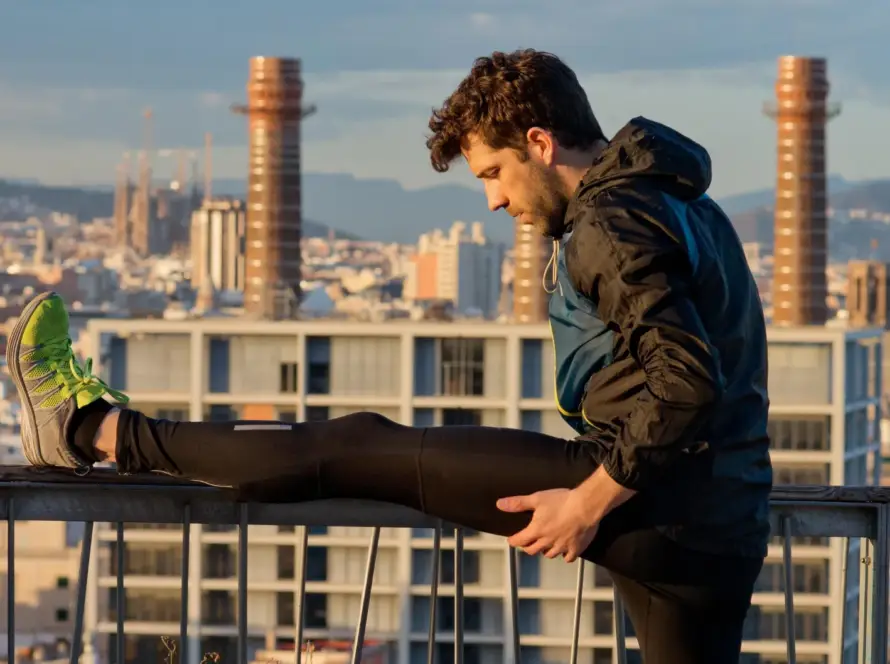 Person doing morning exercise routine in the park during sunrise for better energy and focus.