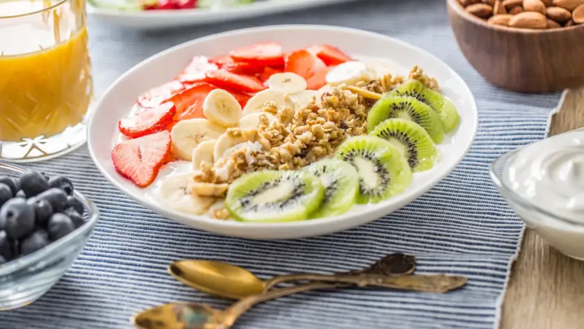Greek yogurt topped with fresh berries, chia seeds, and a drizzle of honey for a protein-rich breakfast ideal for weight loss.