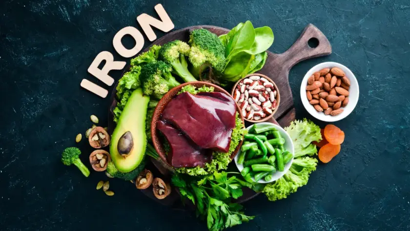 Fresh spinach leaves rich in iron on a kitchen counter