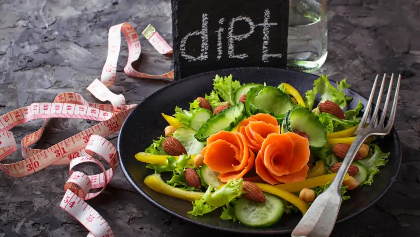 High-carb foods such as rice, oats, potatoes, and fruit on a plate, perfect for high-carb days in carb cycling